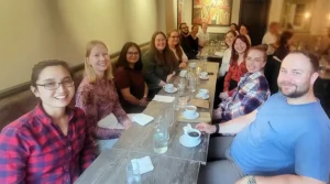 Haapaniemi Group members sitting around a restaurant table at Pavel and Oddrun's farewell dinner