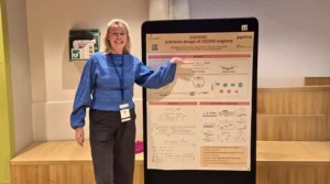 Oline presenting her poster at the 2026 EMBL Partnership Meeting.